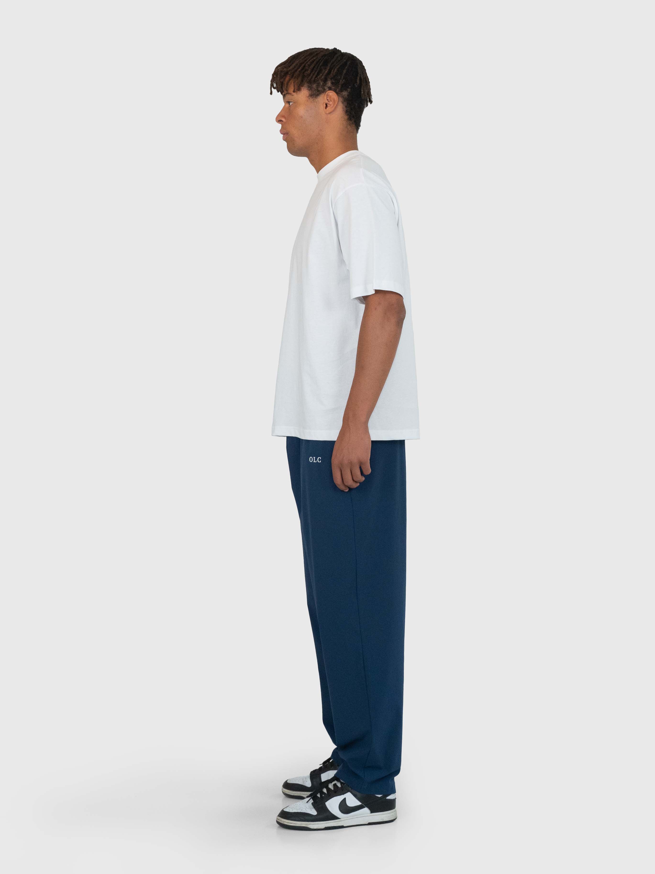 <tc>Essential Tech Pants - marineblauw/wit</tc>